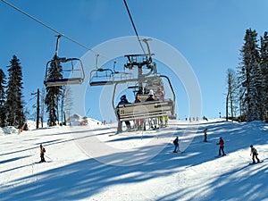 Skiing and snowboarding in the mountain area of Krasnaya Polyana ski resort, Sochi, Russia