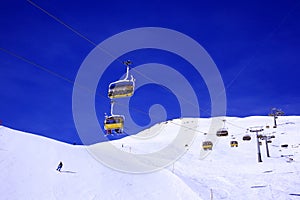 Skiing and snowboarding in ski piste and ski lift in the alps switzerland