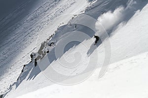 Skiing in the snowy mountains, winter freeride extreme sport