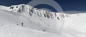 Skiing in the snowy mountains, winter freeride extreme sport