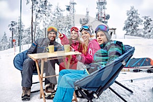 Skiing, winter fun - Family takes tea break during skiing on the