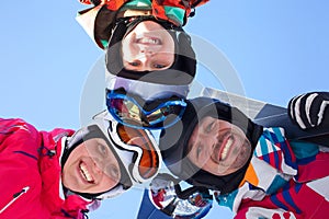 Skiing, winter fun - skiers enjoying ski holidays