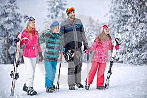 Skiing, winter, snow and fun - family enjoying winter vacations