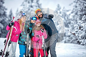 Skiing, winter, snow, sun and fun - family enjoying holiday vacations