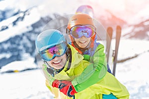 Skiing, winter, snow, sun and fun - kids, boy and girl having fun in the Alps. Child skiing in the mountains.