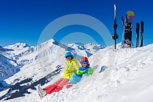 Skiing, winter, snow, sun and fun - kids, boy and girl having fun in the Alps. Child skiing in the mountains.