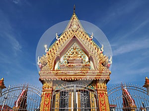 Skilfully crafted Thai temple soars into blue sky