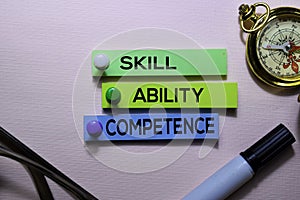 Skill, Ability, Competence text on sticky notes isolated on office desk