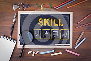 Skill Business concept. On a wooden table chalk board