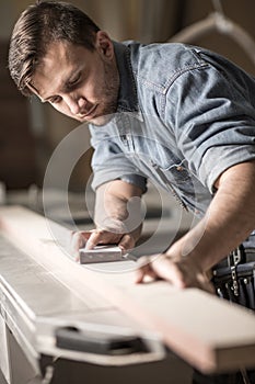 Skilled carpenter working photo