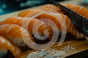 Skilled experienced japanese master chef preparing sushi rolls traditional cuisine restaurant bistro slicing fresh