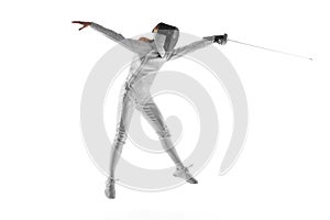 Skilled fencer executing graceful parry, concentration evident in her moves against neutral white studio background