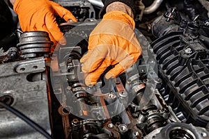 Skilled Hands Repairing a Car Engine