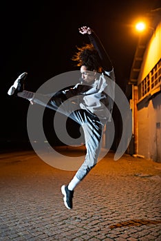 Skilled male dancer at night