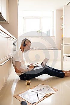 Skilled person using touchpad while checking his records