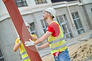 Skilled workers carrying out a residential sewer line installation