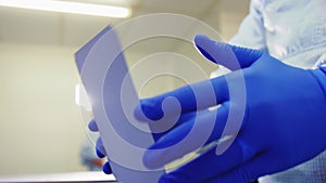 Skilled workers prepare cell plate of solar panel at plant