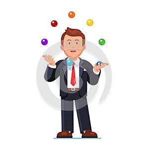 Skillful business man juggling colorful balls