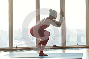 Skillful female athlete doing yoga