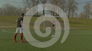 Skillful soccer goalie making penalty save