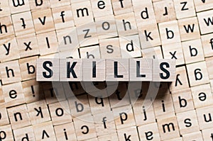 Skills word written on wood block