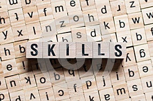 Skills word written on wood block photo