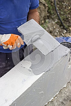 Skim coat concrete wall using set plaster