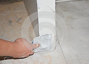 Skim coating the outside corner covering the angle bead with a compound using taping knife