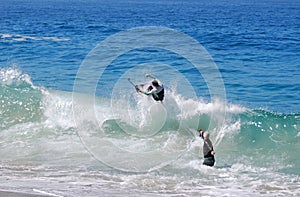 Skimboarder being photographed at Aliso Beach, Laguna Beach, CA