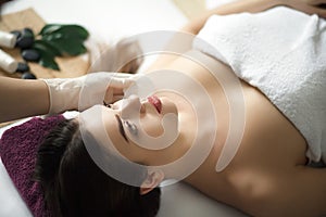 Skin And Body Care. Close-up Of A Young Woman Getting Spa Treatment At Beauty Salon. Spa Face Massage. Facial Beauty Treatment. S