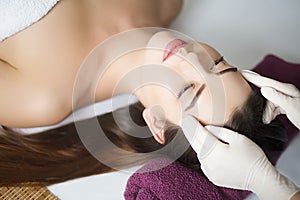 Skin And Body Care. Close-up Of A Young Woman Getting Spa Treatment At Beauty Salon. Spa Face Massage. Facial Beauty Treatment. S