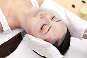 Skin And Body Care. Close-up Of A Young Woman Getting Spa Treatment At Beauty Salon. Spa Face Massage. Facial Beauty Treatment. Sp