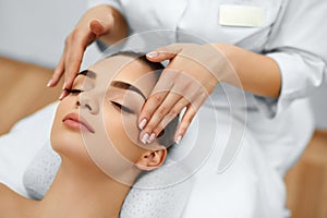 Skin, Body Care. Woman Getting Beauty Spa Face Massage. Treatment.