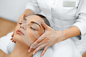 Skin, Body Care. Woman Getting Beauty Spa Face Massage. Treatment.
