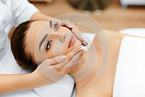 Skin, Body Care. Woman Getting Beauty Spa Face Massage. Treatment.