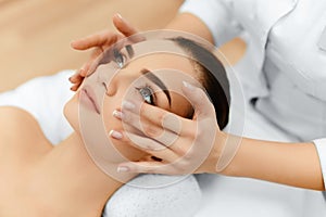 Skin, Body Care. Woman Getting Beauty Spa Face Massage. Treatment. photo