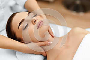 Skin, Body Care. Woman Getting Beauty Spa Face Massage. Treatment.