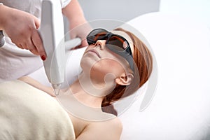 Skin and body care. woman receives an electric massage in beauty salon