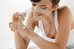 Skin Care. Beautiful Happy Woman With Hand Cream, Lotion On Hand