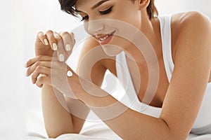 Skin Care. Beautiful Happy Woman With Hand Cream, Lotion On Hand