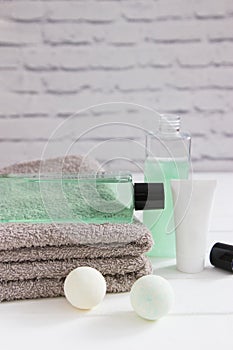 Skin care beauty products cotton towels vertical front view