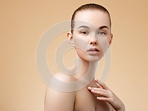 Skin care. Beauty Spa Woman with perfect skin Portrait. Beautiful Spa Girl. Proposing a product. Gestures for