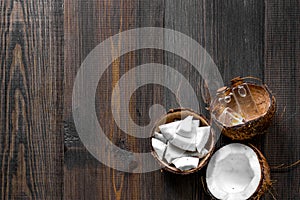 Skin care. Coconut lotion on wooden table background top view copyspace