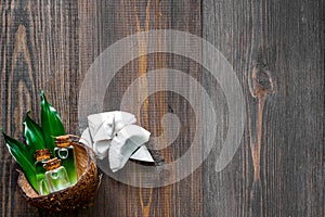 Skin care. Coconut lotion on wooden table background top view copyspace