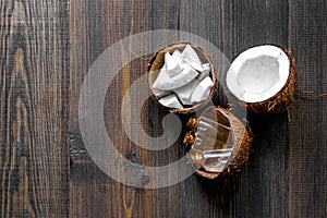 Skin care. Coconut lotion on wooden table background top view copyspace