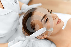 Skin Care. Cosmetic Cream On Woman's Face. Beauty Spa Treatment photo