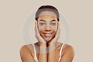 Skin care and facial treatment concept. Woman with beauty face touching her healthy facial skin portrait