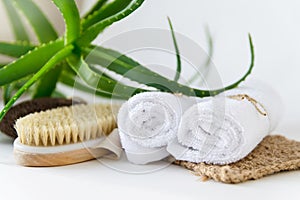 Skin care at home. Eco-friendly bath and spa accessories: body brush, towels, washcloth, aloe.