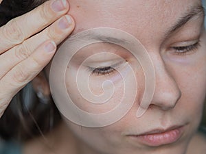 Skin care, portrait of a young beautiful woman close-up, without makeup and retouching.