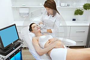 Skin Care. Pregnant Woman On Face Cleansing At Beauty Clinic